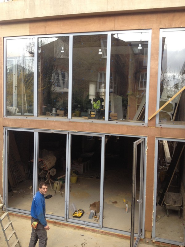 Aluminium bi-fold doors with two-storey glazing in Putney