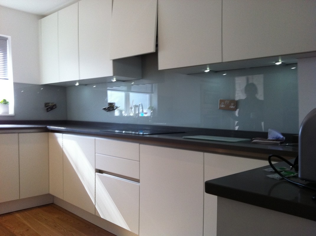 Grey glass kitchen splashback with LED lighting in Putney