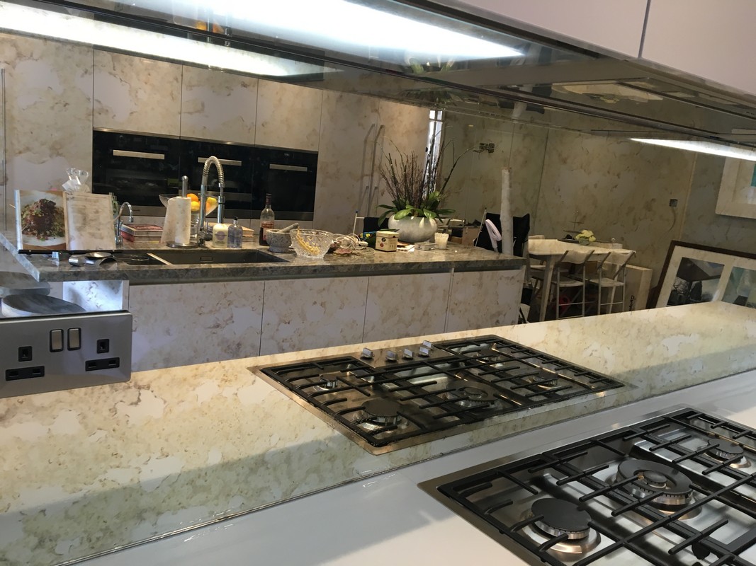 Mirror glass splashback in Putney luxury kitchen