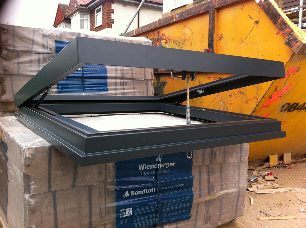 Opening flat roof skylight in anthracite grey installed in Putney